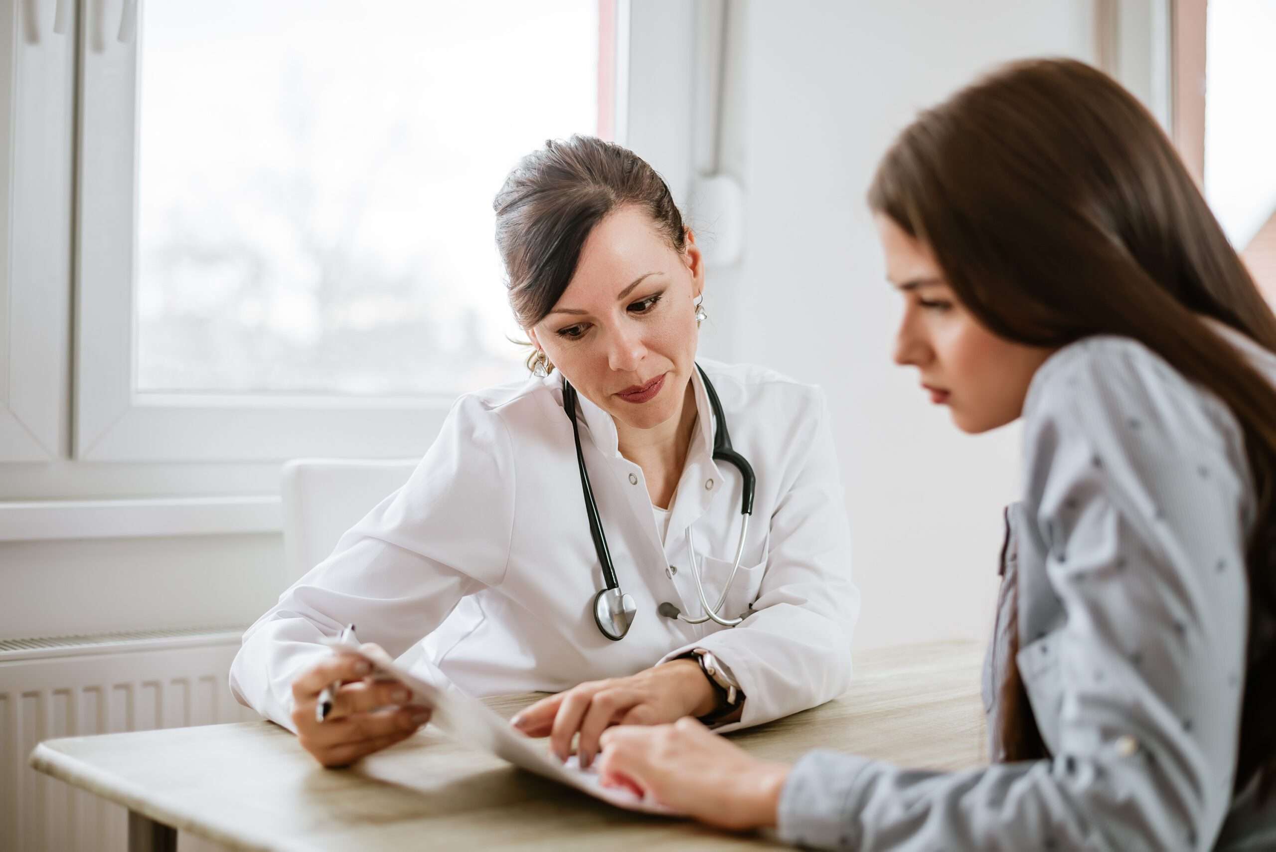 Friendly Female Physician Offering Advice to a Patient